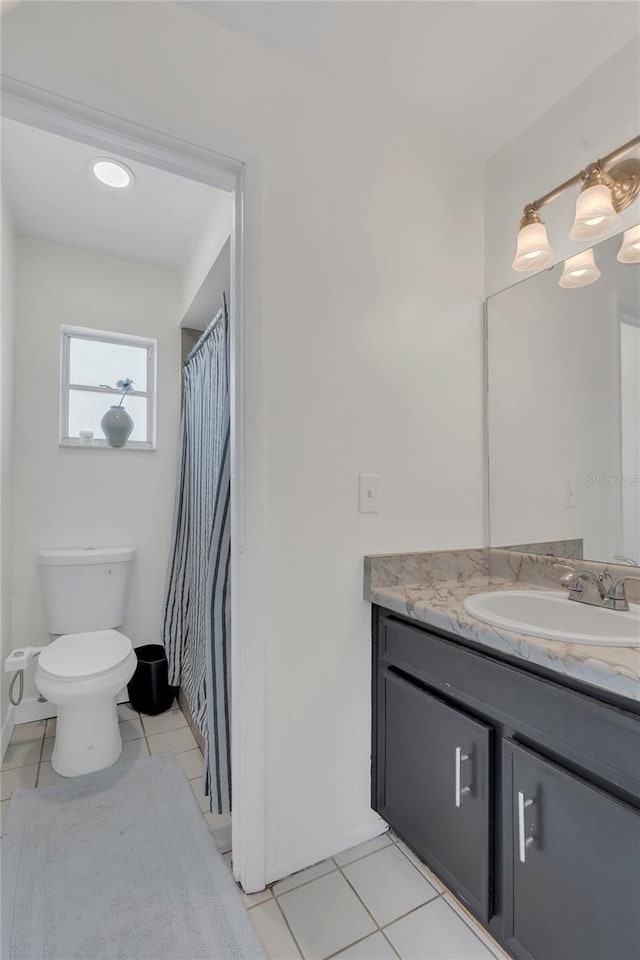 4636 Mesa Verde Dr, Saint Cloud, FL 34769 - bathroom with vanity, tile patterned flooring, and a shower with curtain