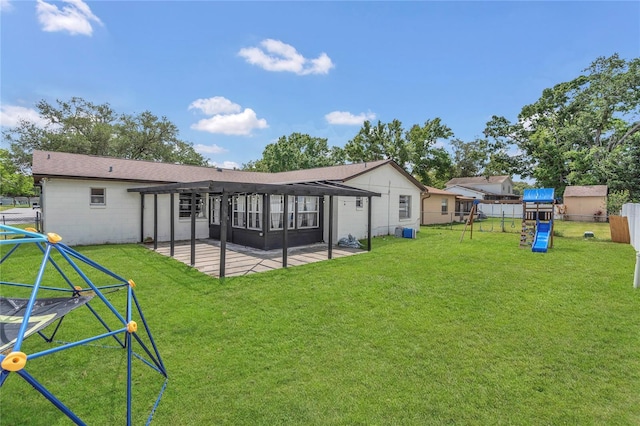 4636 Mesa Verde Dr, Saint Cloud, FL 34769 - back of property with a playground, a patio, a fenced backyard, a pergola, and concrete block siding