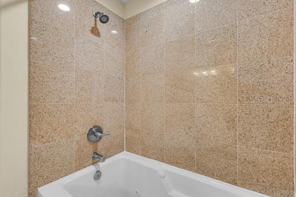 13427 Blue Heron Beach Dr Unit 1205, Orlando, FL 32821 - interior details featuring a combined bath / shower with jetted tub