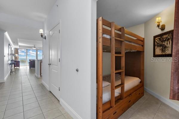 13427 Blue Heron Beach Dr Unit 1205, Orlando, FL 32821 - hall with baseboards and light tile patterned floors