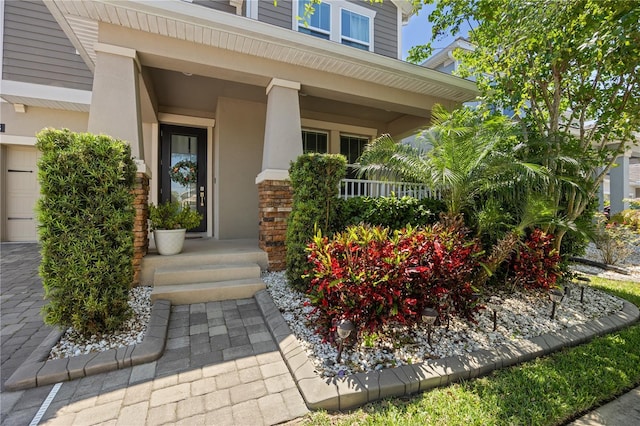 12048 Imaginary Way, Orlando, FL 32832 - entrance to property featuring covered porch and stucco siding