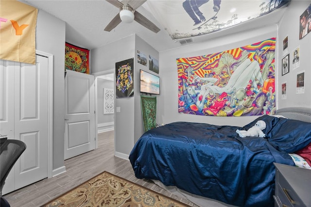 12048 Imaginary Way, Orlando, FL 32832 - bedroom featuring wood finished floors, visible vents, a ceiling fan, and baseboards