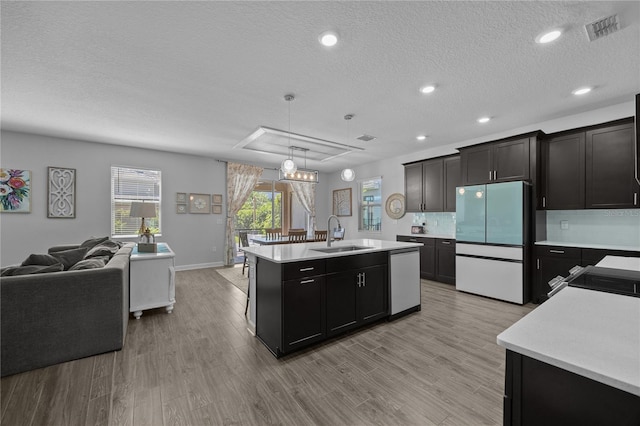 12048 Imaginary Way, Orlando, FL 32832 - kitchen with light countertops, appliances with stainless steel finishes, open floor plan, and a sink
