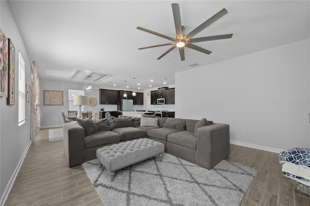 12048 Imaginary Way, Orlando, FL 32832 - living room featuring light wood-type flooring and baseboards