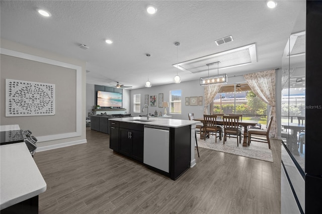 12048 Imaginary Way, Orlando, FL 32832 - kitchen with light countertops, visible vents, dark cabinetry, a sink, and appliances with stainless steel finishes