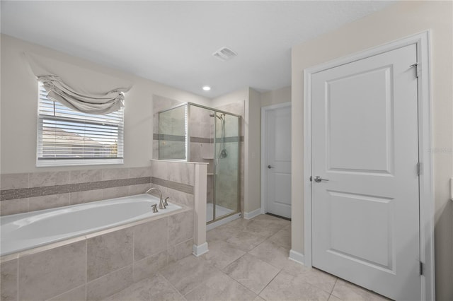 12048 Imaginary Way, Orlando, FL 32832 - bathroom with a shower stall, a garden tub, tile patterned flooring, and visible vents