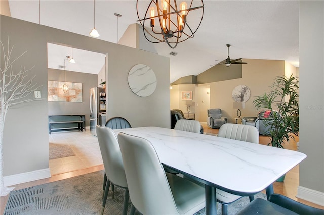 400 Shelby Ct, Apopka, FL 32712 - dining room with ceiling fan, vaulted ceiling, baseboards, and a chandelier