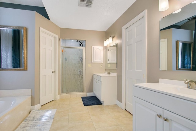 400 Shelby Ct, Apopka, FL 32712 - bathroom with a stall shower, a garden tub, baseboards, and two vanities