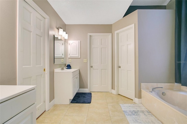 400 Shelby Ct, Apopka, FL 32712 - bathroom featuring vanity, baseboards, tile patterned flooring, and a bath