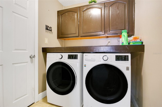 400 Shelby Ct, Apopka, FL 32712 - laundry area with washing machine and dryer, cabinet space, light tile patterned flooring, and baseboards