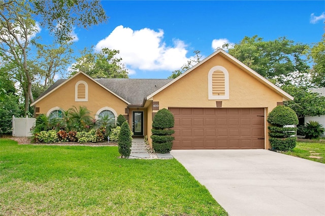 400 Shelby Ct, Apopka, FL 32712 - view of front facade with a garage, stucco siding, a front yard, and driveway