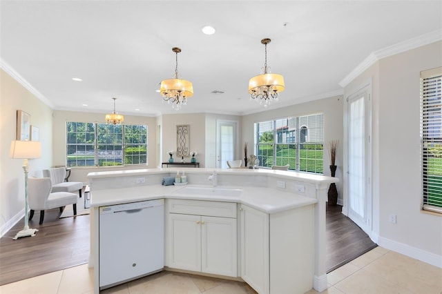 1565 Corkery Ct, Winter Springs, FL 32708 - kitchen with crown molding, a wealth of natural light, a chandelier, and dishwasher