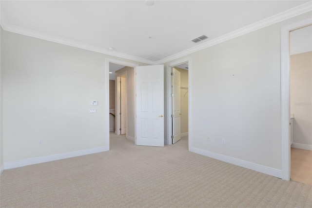 1565 Corkery Ct, Winter Springs, FL 32708 - unfurnished bedroom featuring visible vents, baseboards, crown molding, a walk in closet, and light colored carpet