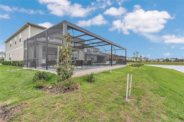 13640 Haulover Beach Ln, Orlando, FL 32827 - back of property with a patio, a yard, a pool, and glass enclosure