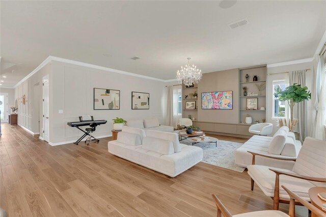 13640 Haulover Beach Ln, Orlando, FL 32827 - living room featuring light wood-style floors, crown molding, a notable chandelier, and visible vents