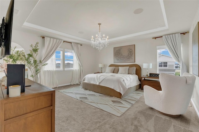 13640 Haulover Beach Ln, Orlando, FL 32827 - bedroom with a raised ceiling, crown molding, a chandelier, and light colored carpet