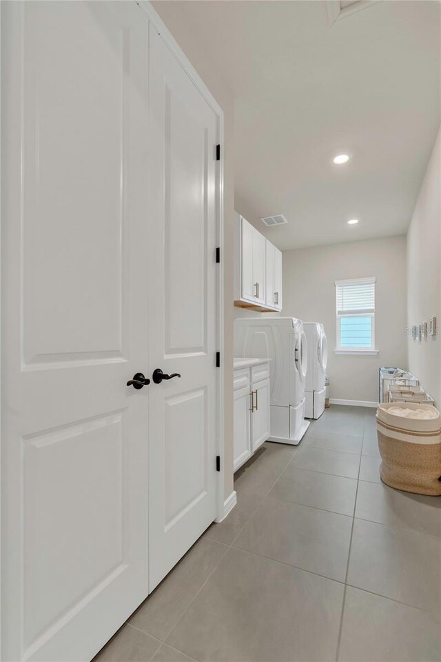 13640 Haulover Beach Ln, Orlando, FL 32827 - bathroom with baseboards, recessed lighting, tile patterned floors, visible vents, and independent washer and dryer