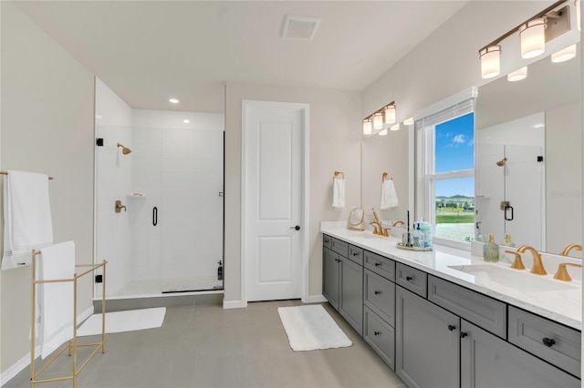 13640 Haulover Beach Ln, Orlando, FL 32827 - full bath with a shower stall, double vanity, visible vents, and a sink