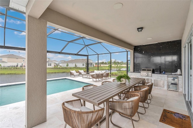 13640 Haulover Beach Ln, Orlando, FL 32827 - pool featuring exterior kitchen, a grill, a patio area, a lanai, and a sink