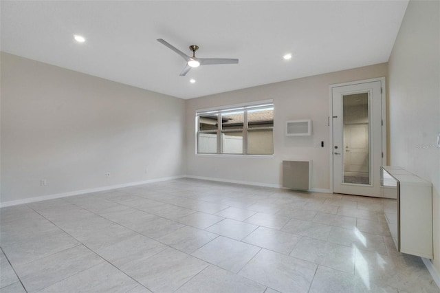 empty room featuring a ceiling fan, baseboards, and recessed lighting
