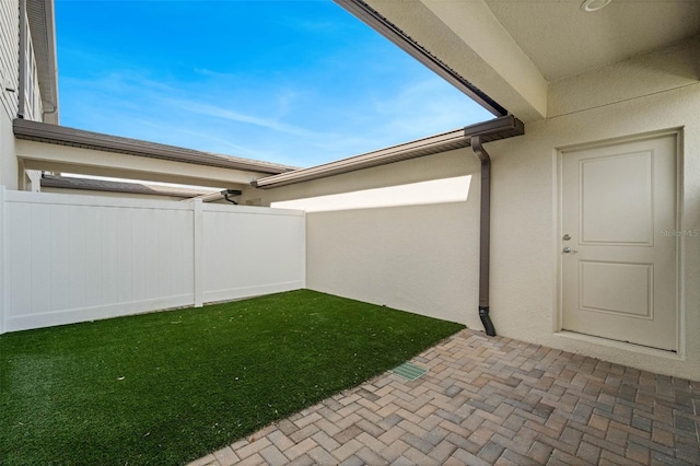 view of yard with fence and a patio area
