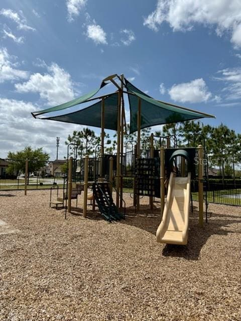 communal playground featuring fence