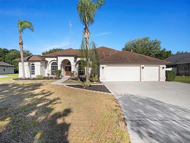 view of front of home featuring stucco siding, a garage, a front lawn, and concrete driveway