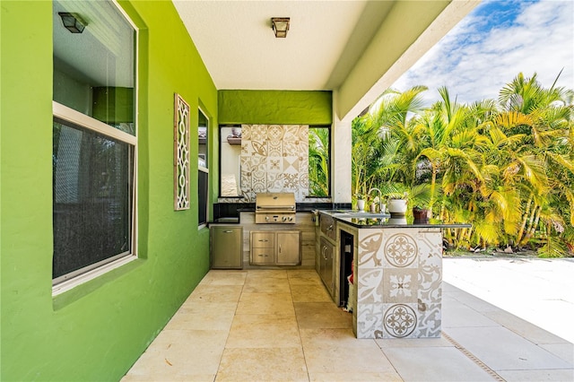 view of patio / terrace featuring area for grilling and a grill