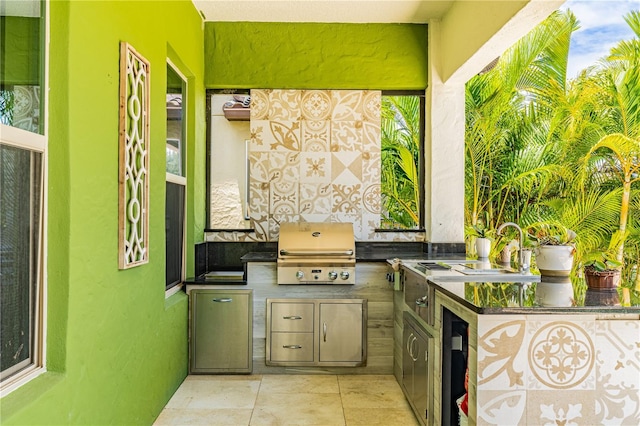 view of patio featuring a grill and exterior kitchen