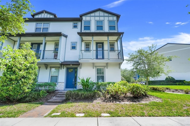 7772 Sweet Star Ave, Orlando, FL 32836 - view of property featuring stucco siding and a balcony