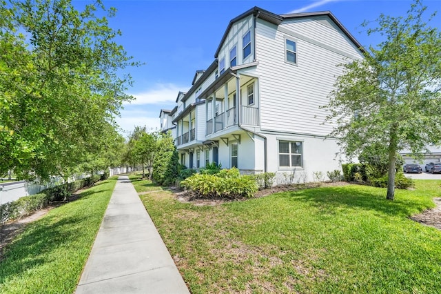 7772 Sweet Star Ave, Orlando, FL 32836 - view of home's exterior with stucco siding and a lawn