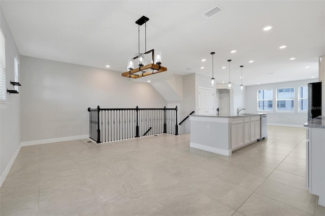 7772 Sweet Star Ave, Orlando, FL 32836 - kitchen featuring visible vents, white cabinets, dishwasher, a sink, and open floor plan