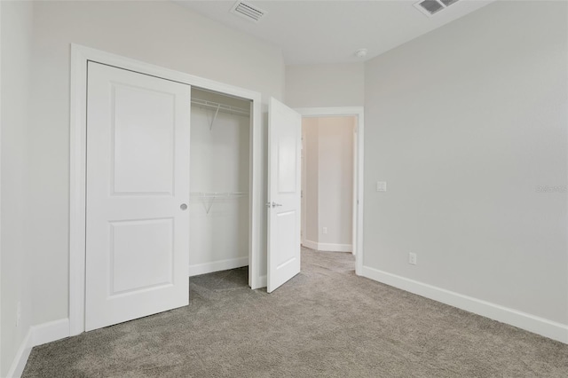 7772 Sweet Star Ave, Orlando, FL 32836 - unfurnished bedroom with visible vents, baseboards, carpet flooring, and a closet