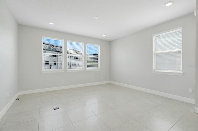 7772 Sweet Star Ave, Orlando, FL 32836 - spare room featuring baseboards and recessed lighting