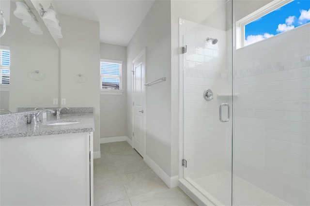 7772 Sweet Star Ave, Orlando, FL 32836 - full bathroom featuring a stall shower, vanity, baseboards, and tile patterned flooring