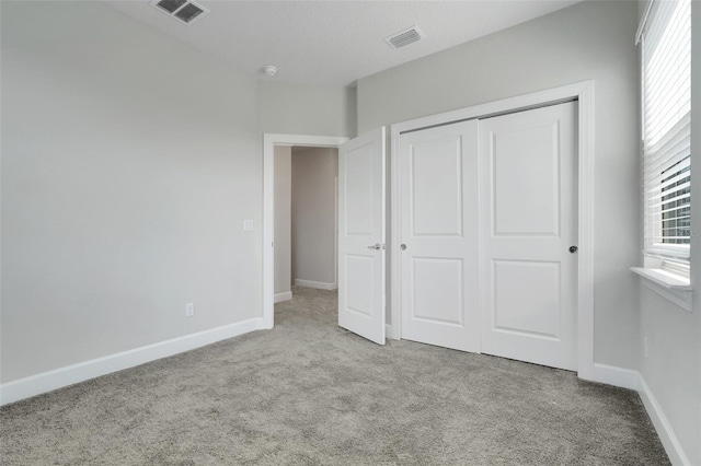 7772 Sweet Star Ave, Orlando, FL 32836 - unfurnished bedroom with visible vents, a closet, and carpet floors