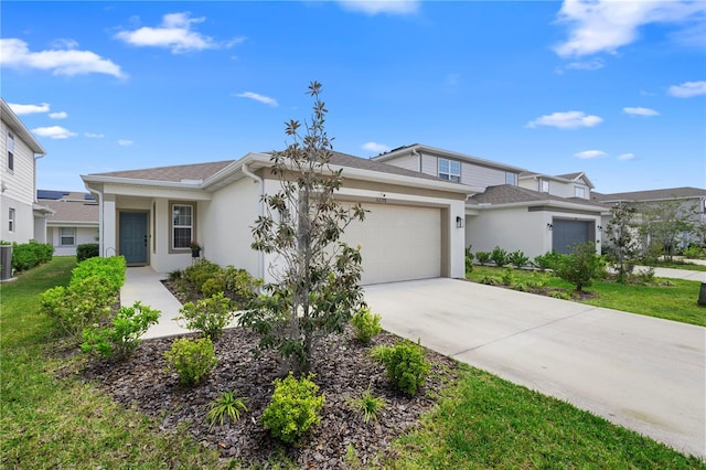 view of front of home featuring a garage, driveway, stucco siding, and a front lawn