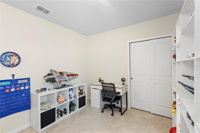 office featuring light tile patterned floors, baseboards, and visible vents