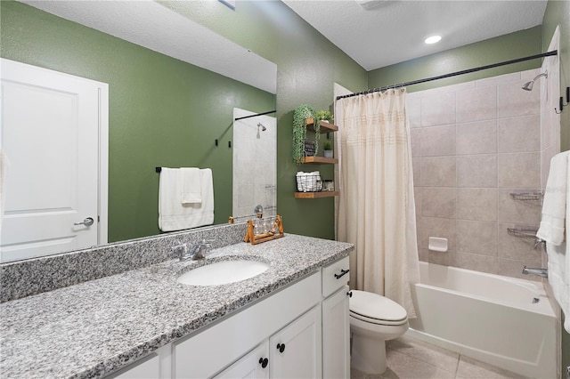 full bath featuring tile patterned flooring, shower / bath combo with shower curtain, vanity, and toilet