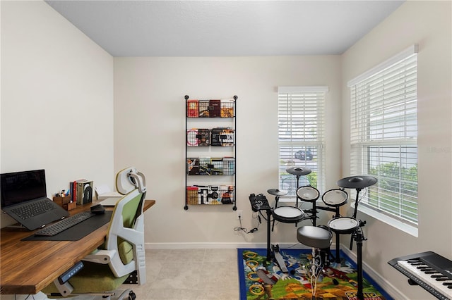 office area featuring tile patterned floors and baseboards