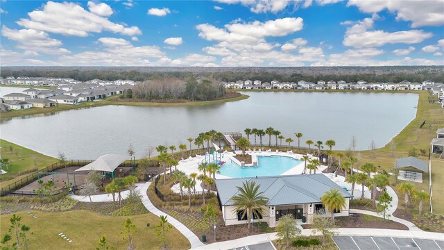 bird's eye view with a residential view and a water view