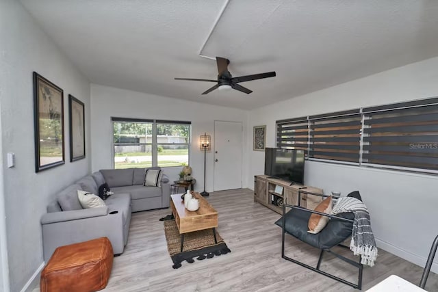 1405 Smith Dr N, Titusville, FL 32780 - living room featuring wood finished floors, baseboards, and ceiling fan