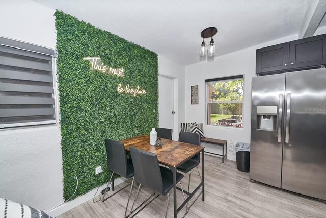 1405 Smith Dr N, Titusville, FL 32780 - dining space featuring light wood-type flooring