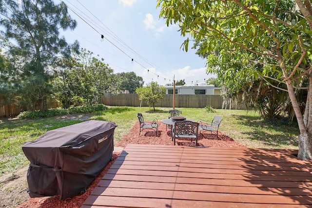 1405 Smith Dr N, Titusville, FL 32780 - deck with a fenced backyard and a yard