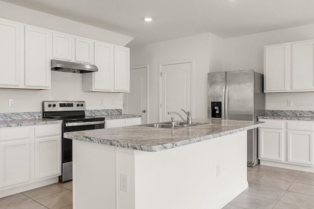 715 Chinoy Rd, Davenport, FL 33837 - kitchen with light tile patterned floors, an island with sink, under cabinet range hood, stainless steel appliances, and a sink