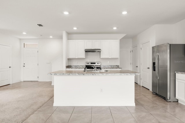 715 Chinoy Rd, Davenport, FL 33837 - kitchen featuring white cabinets, recessed lighting, visible vents, under cabinet range hood, and stainless steel appliances