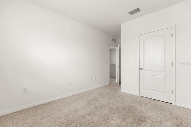 715 Chinoy Rd, Davenport, FL 33837 - unfurnished bedroom featuring carpet flooring, visible vents, and baseboards