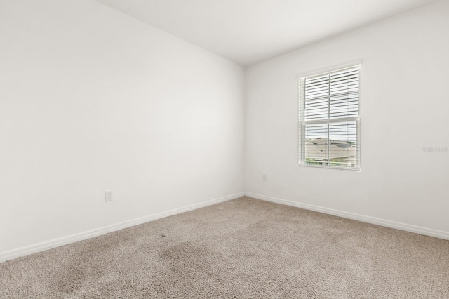 715 Chinoy Rd, Davenport, FL 33837 - unfurnished room with light colored carpet and baseboards