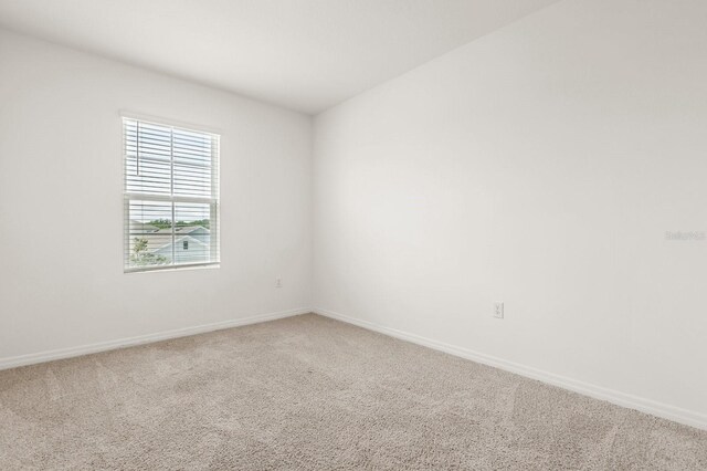 715 Chinoy Rd, Davenport, FL 33837 - unfurnished room featuring carpet floors and baseboards
