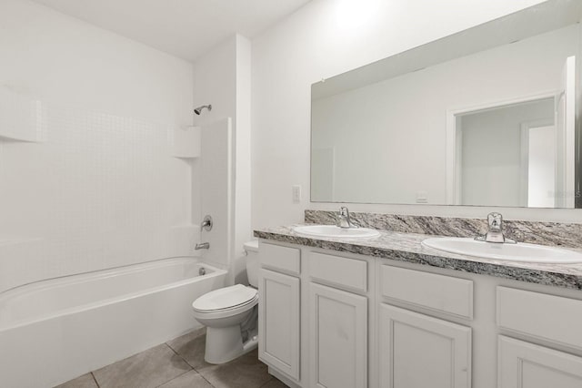 715 Chinoy Rd, Davenport, FL 33837 - bathroom featuring a sink, toilet, double vanity, and tile patterned flooring